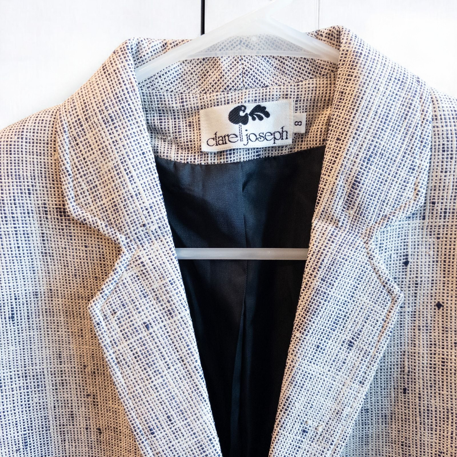 Clare Joseph vintage blue and white raw silk blazer with padded shoulders and two button closure hanging on hanger image 2