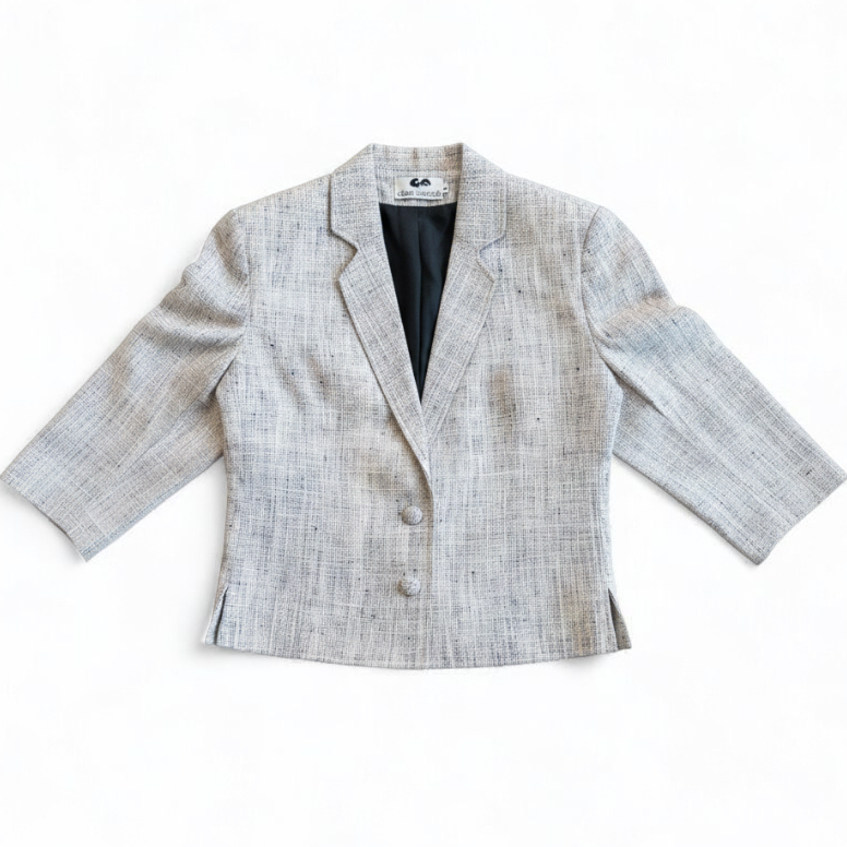 Clare Joseph vintage blue and white raw silk blazer with padded shoulders and two button closure hanging on hanger front on white muslin photography backdrop