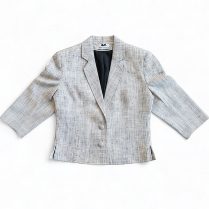 Clare Joseph vintage blue and white raw silk blazer with padded shoulders and two button closure hanging on hanger front on white muslin photography backdrop
