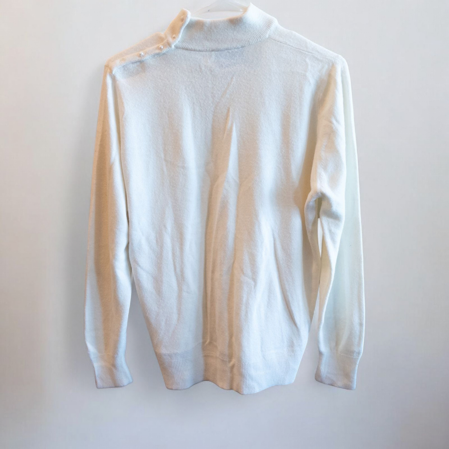 Designers Originals white women’s medium turtleneck sweater with pearl buttons on shoulder hanging on hanger image 3
