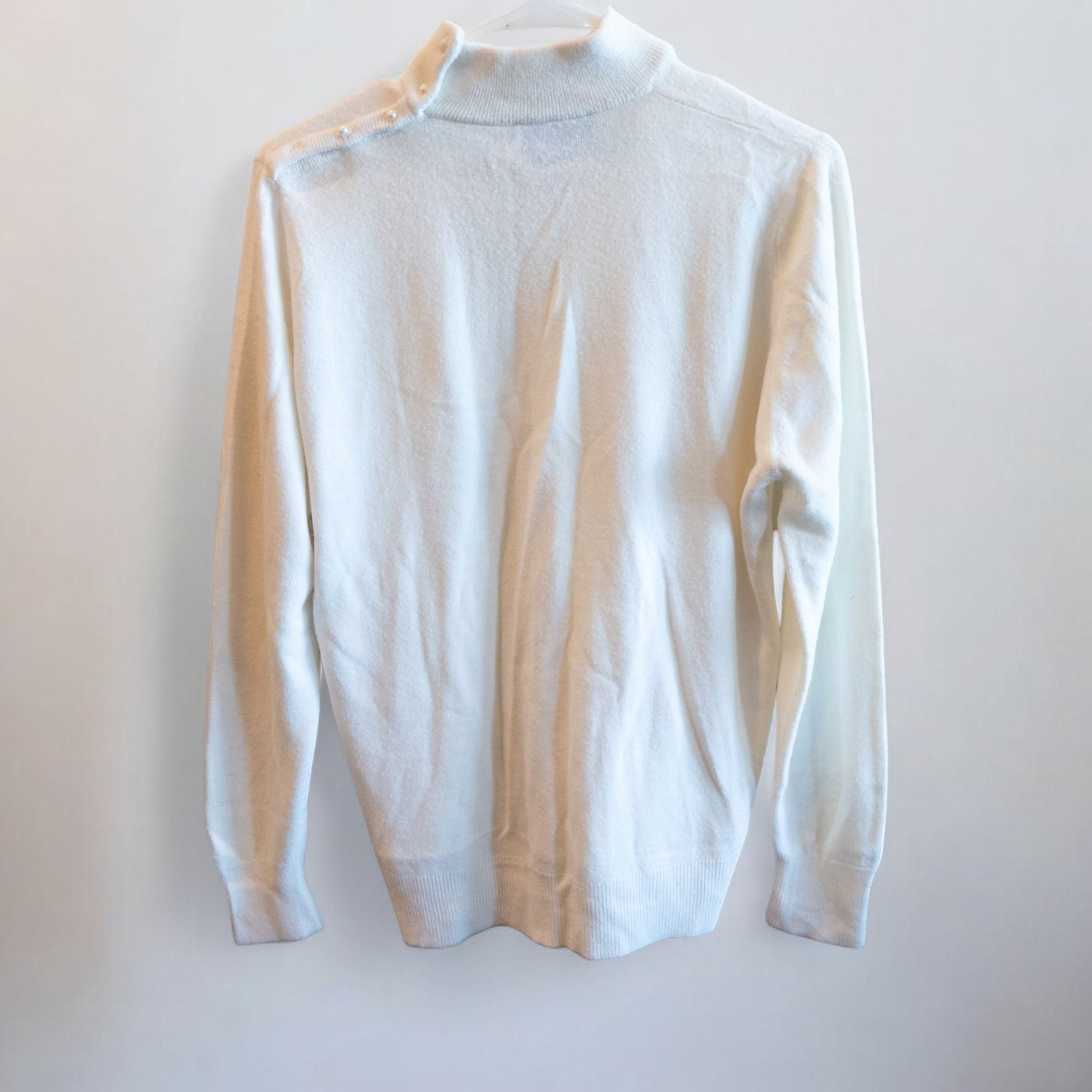 Designers Originals white women’s medium turtleneck sweater with pearl buttons on shoulder hanging on hanger image 3