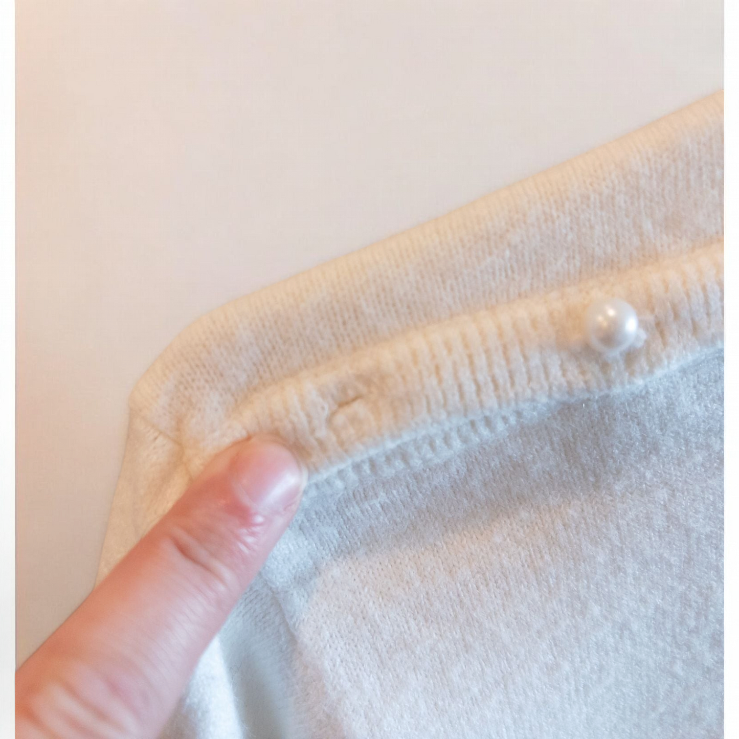 Designers Originals white women’s medium turtleneck sweater with pearl buttons on shoulder hanging on hanger image 5