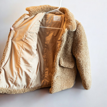 Zara brown teddy bear coat kids size 13 14 hanging on wall, showing front, back, inside lining and close up details of pockets and buttons image 6