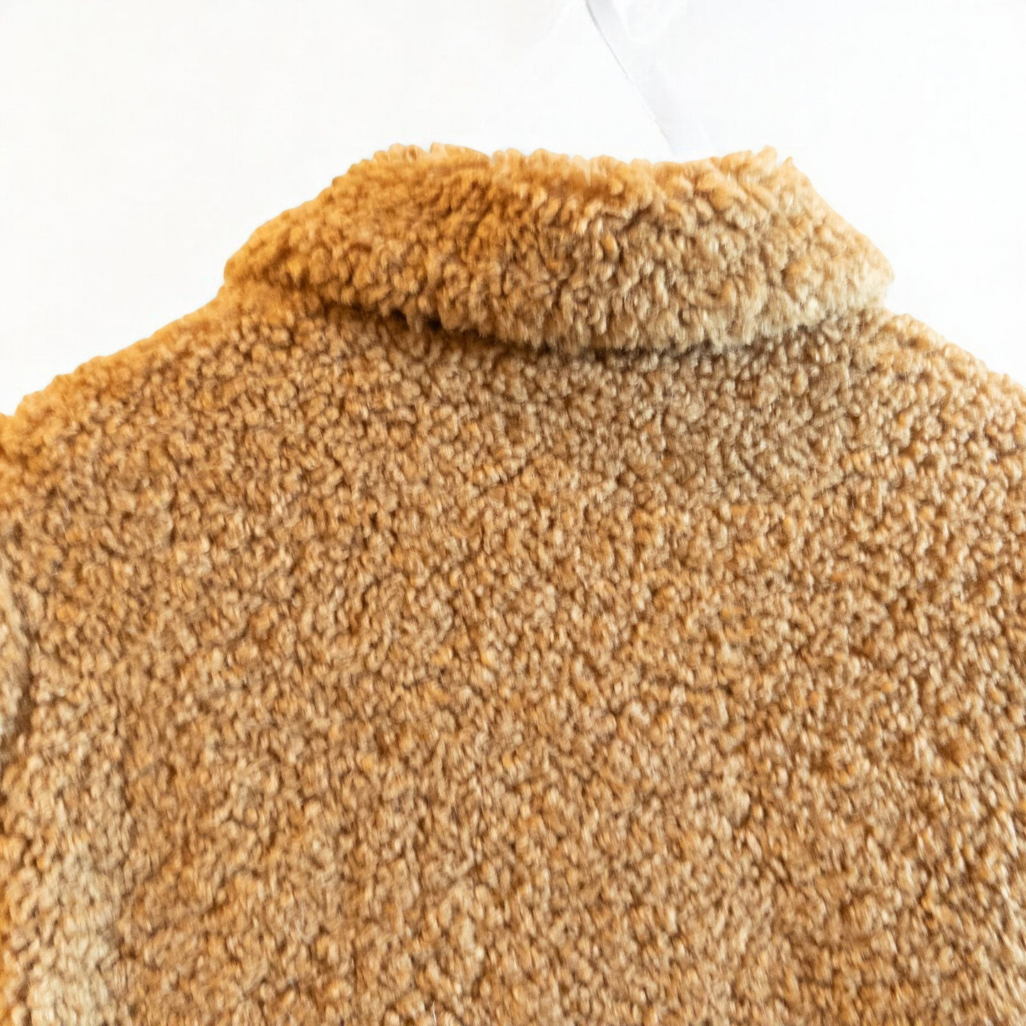 Zara brown teddy bear coat kids size 13 14 hanging on wall, showing front, back, inside lining and close up details of pockets and buttons image 8