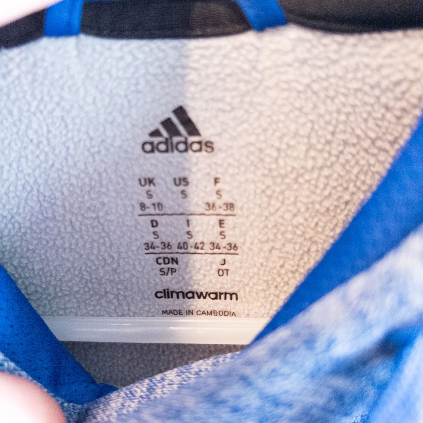 Adidas Climawarm blue heathered fleece pullover hoodie with kangaroo pocket and thumbhole cuffs shown front and back image 8