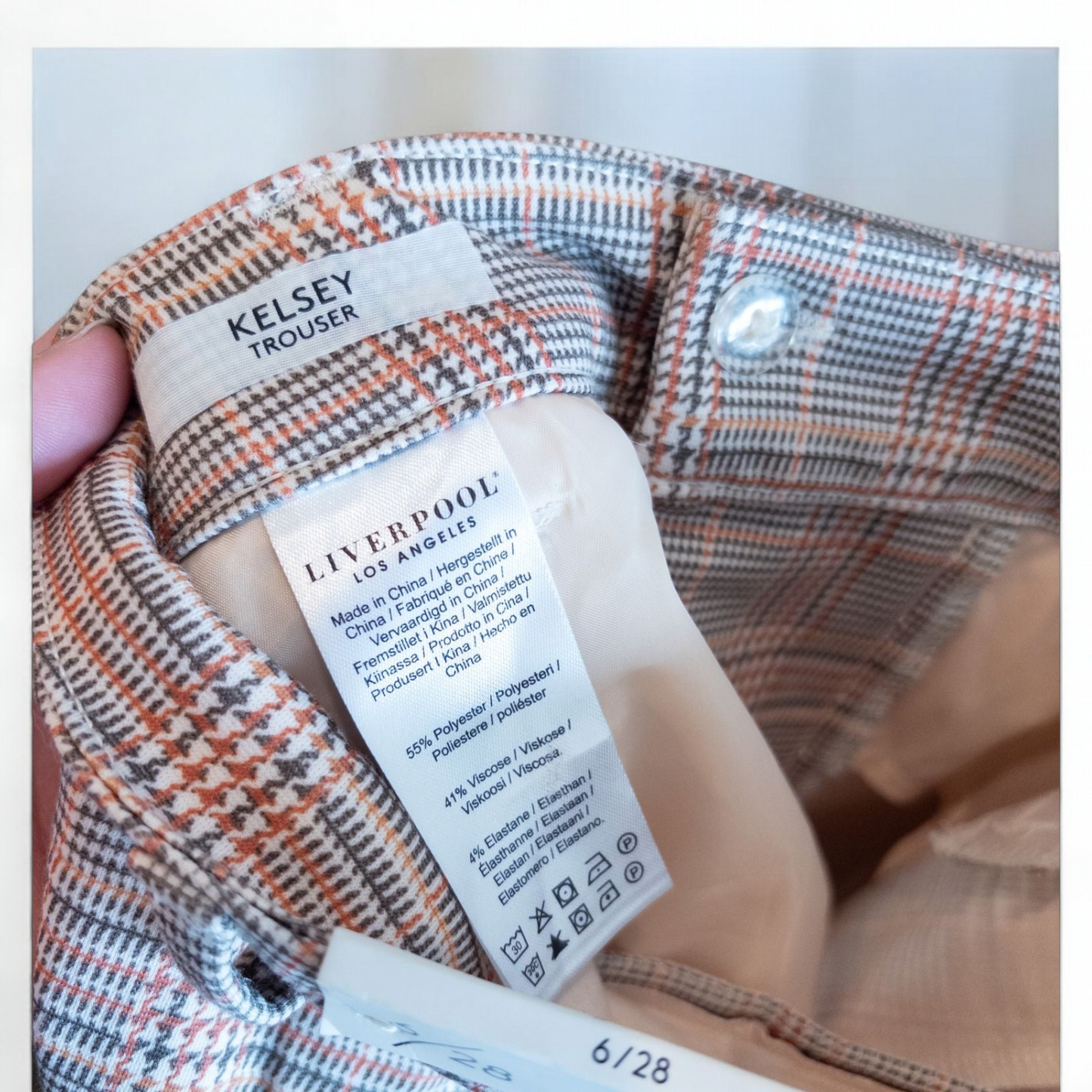 Liverpool Kelsey Lava Flow orange plaid straight leg trousers with tags hanging on white cabinet image 10