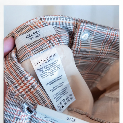 Liverpool Kelsey Lava Flow orange plaid straight leg trousers with tags hanging on white cabinet image 10