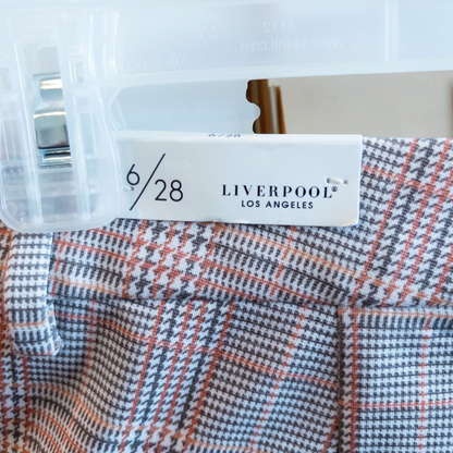 Liverpool Kelsey Lava Flow orange plaid straight leg trousers with tags hanging on white cabinet image 11