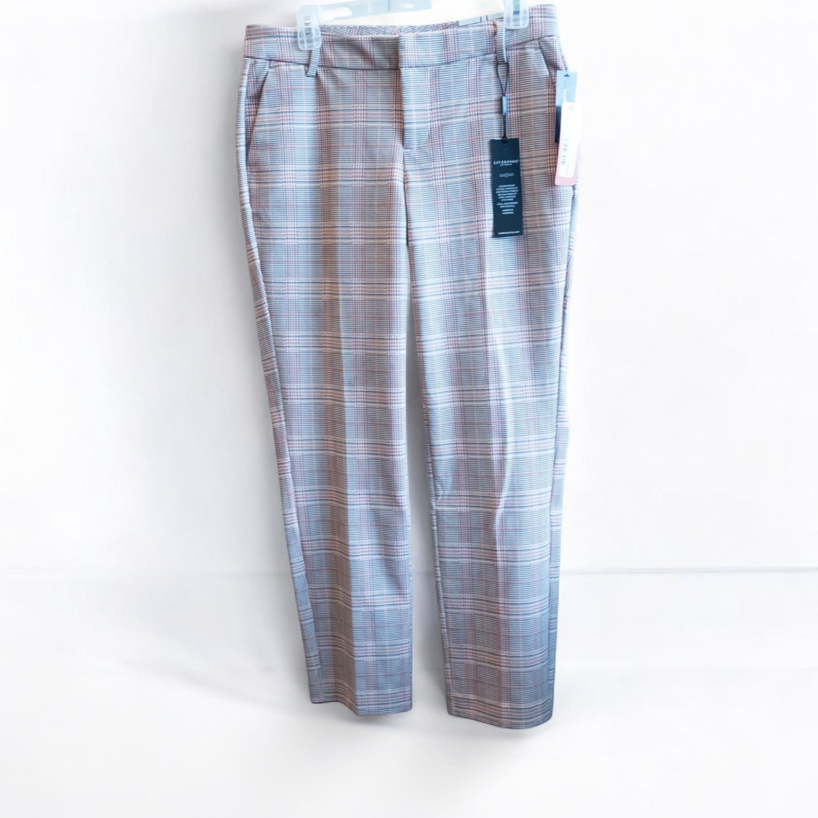 Liverpool Kelsey Lava Flow orange plaid straight leg trousers with tags hanging on white cabinet