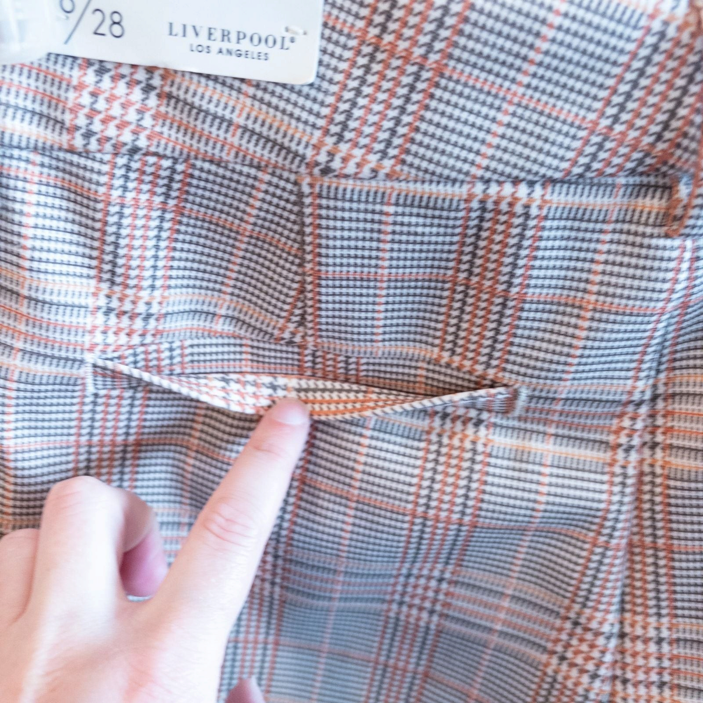 Liverpool Kelsey Lava Flow orange plaid straight leg trousers with tags hanging on white cabinet image 8