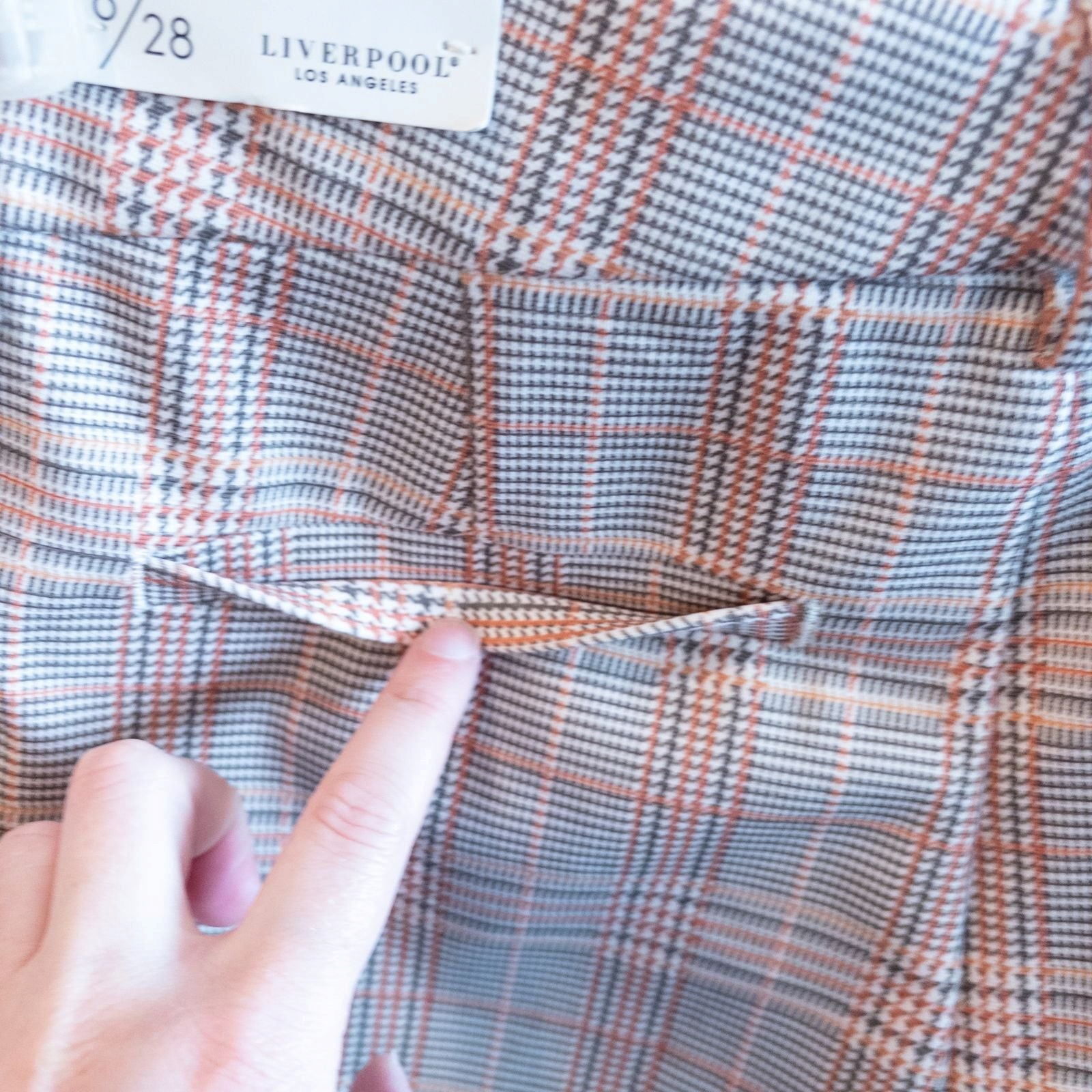 Liverpool Kelsey Lava Flow orange plaid straight leg trousers with tags hanging on white cabinet image 8
