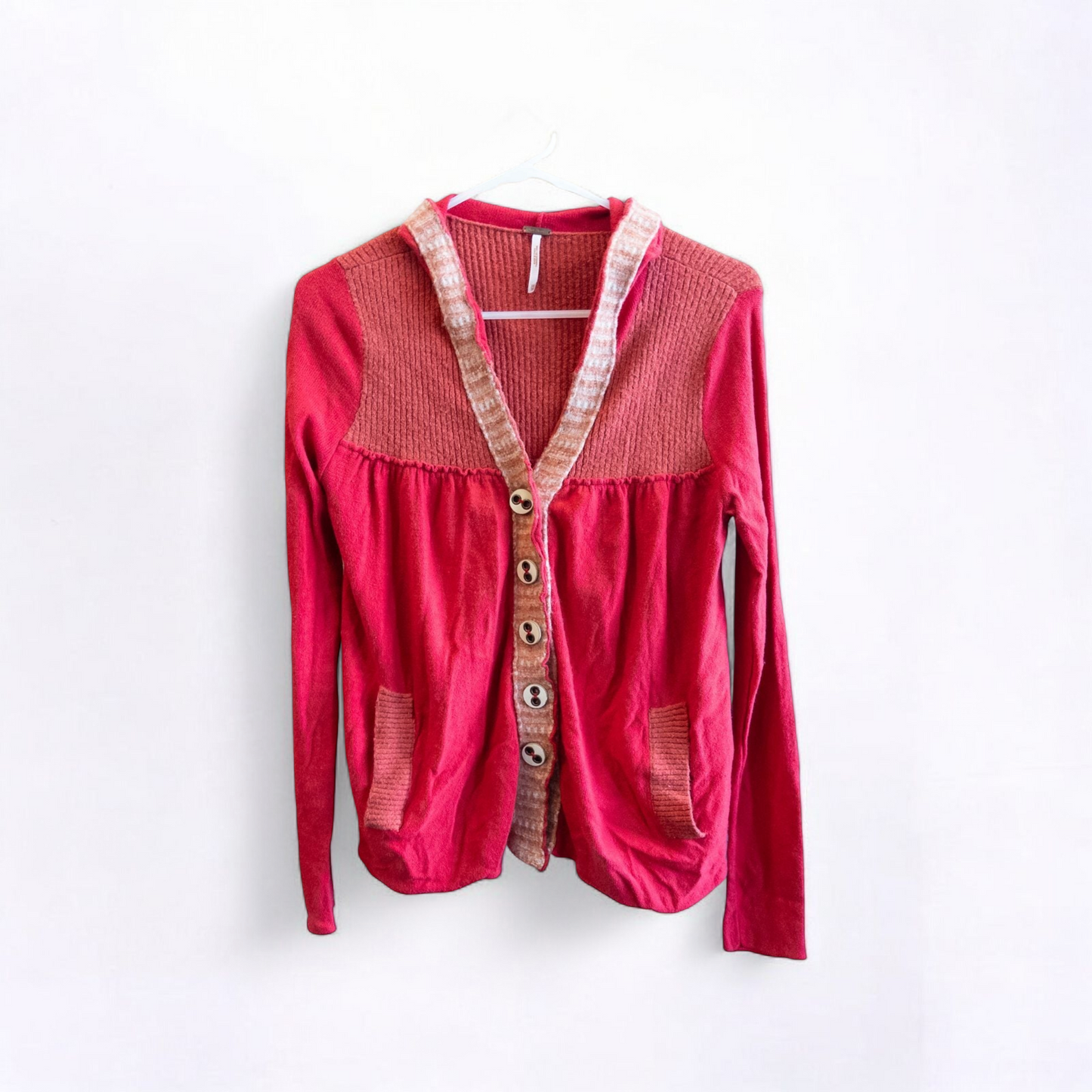 Free People red wool knit cardigan sweater with hood and button front, hung on white hanger image 2