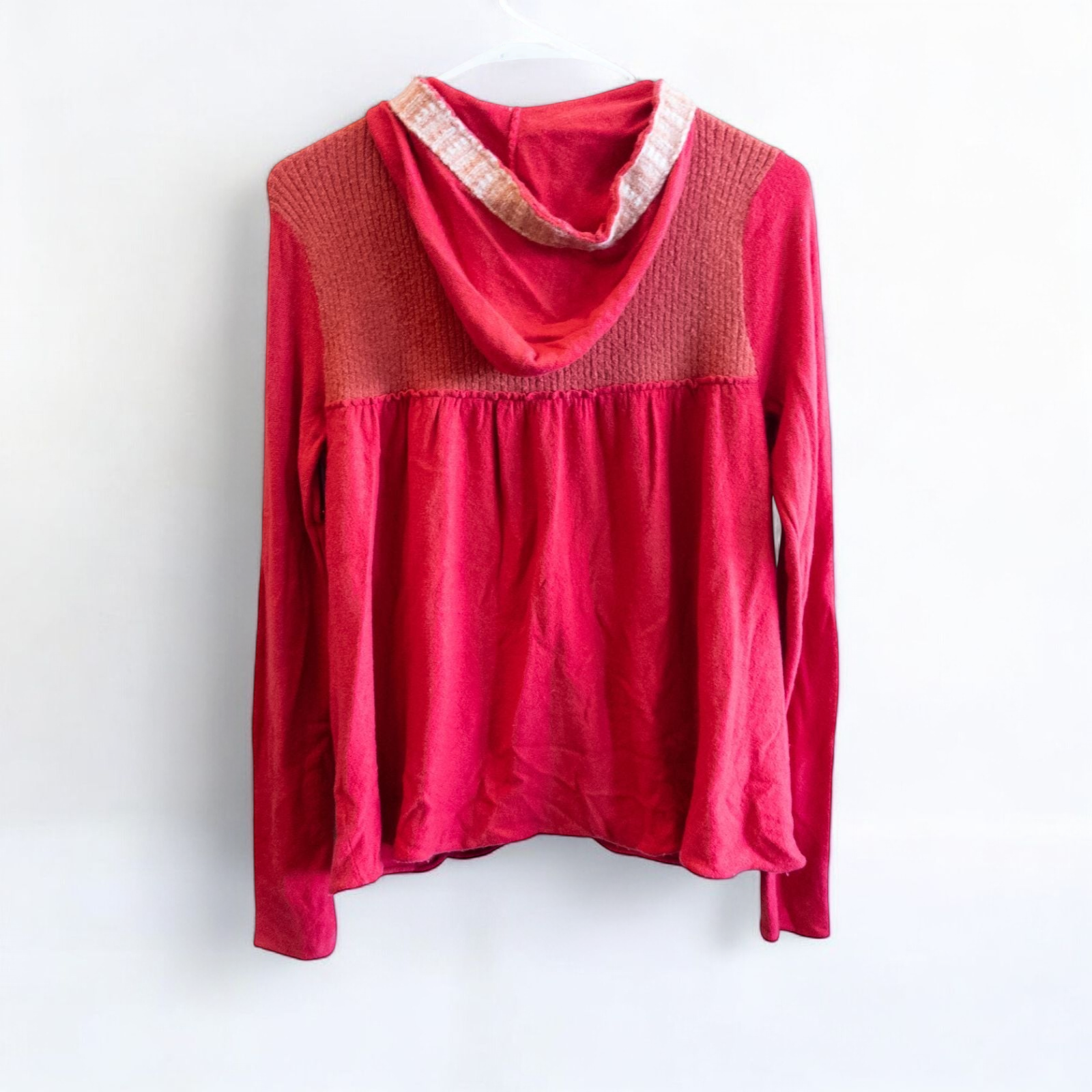 Free People red wool knit cardigan sweater with hood and button front, hung on white hanger image 7