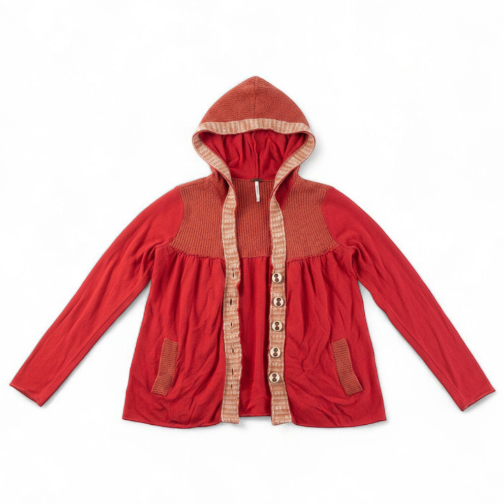 Free People red wool knit cardigan sweater with hood and button front, hung on white hanger front on white muslin photography backdrop