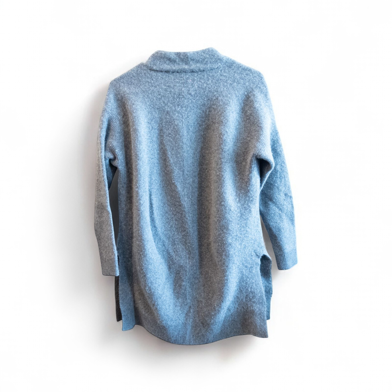 Athleta gray wool cashmere open knit sweater cardigan hanging on white door with two front pockets and ribbed cuffs, showing small brown speck on pocket and fuzzy texture image 7