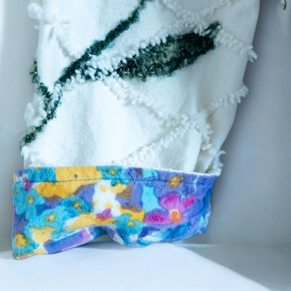 Keren Hart vintage embroidered flower jacket in white with multicolor floral embroidery on a woman and hanging on hangers image 12