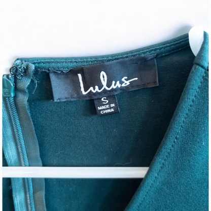 Lulus green sleeveless mini dress with deep v-neck and back zipper hanging on white hanger image 7