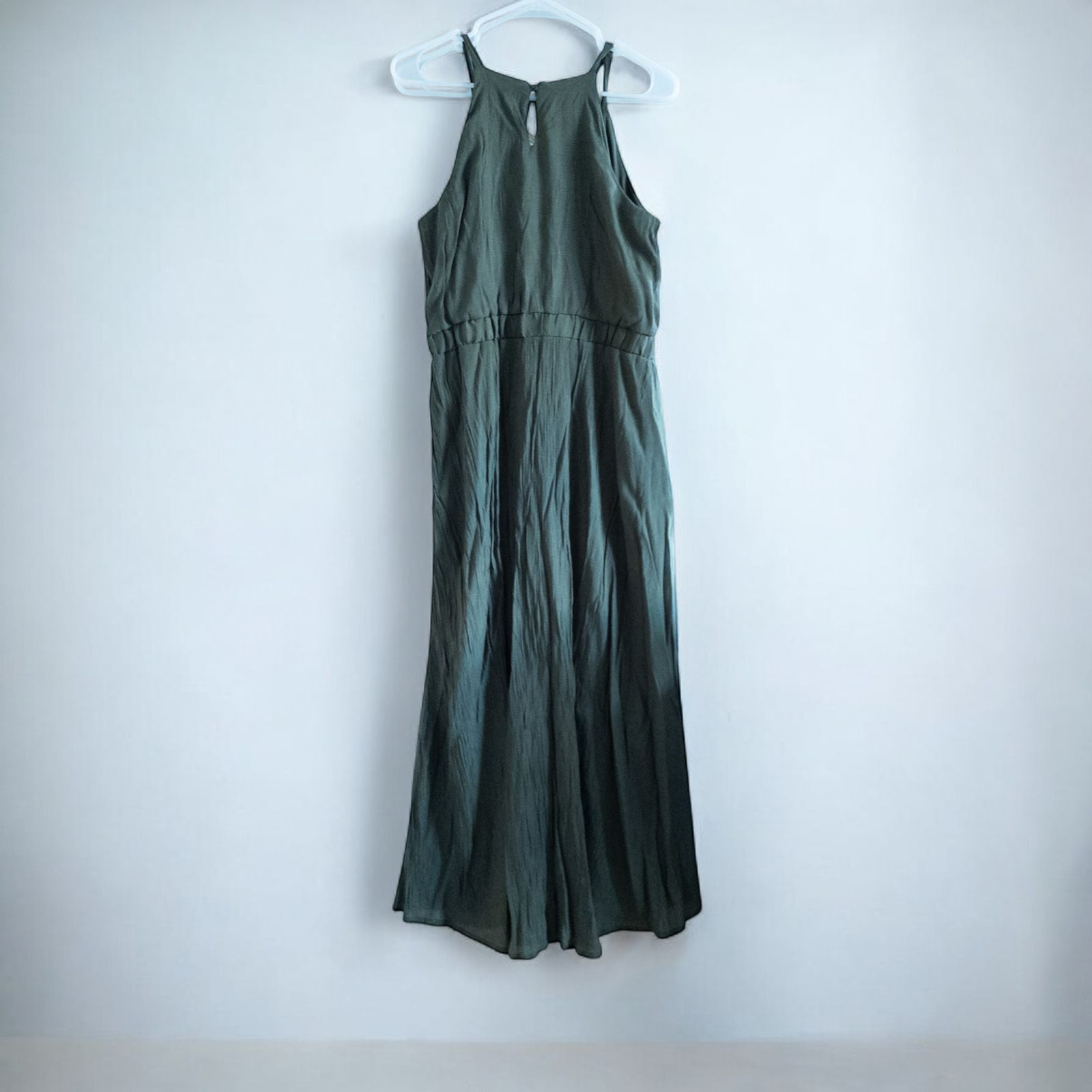 Luxology green slit maxi dress hanging on a hanger in front of a mirror image 5