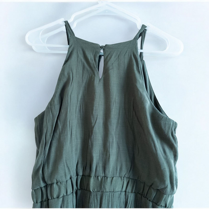 Luxology green slit maxi dress hanging on a hanger in front of a mirror image 6