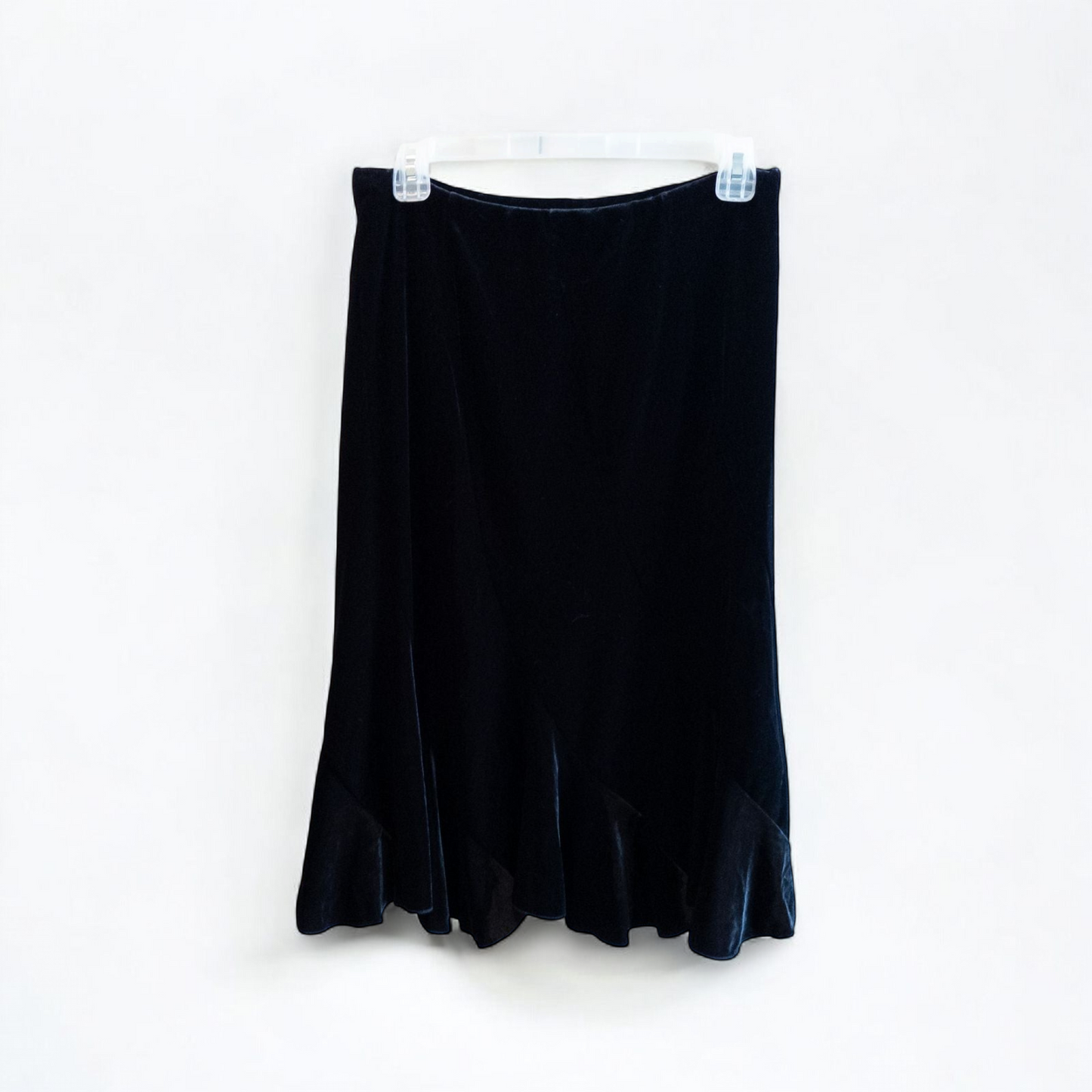 Alex black velvet jacket and skirt set hanging on hanger, showing classic fitted jacket with padded shoulders and flared skirt. image 6