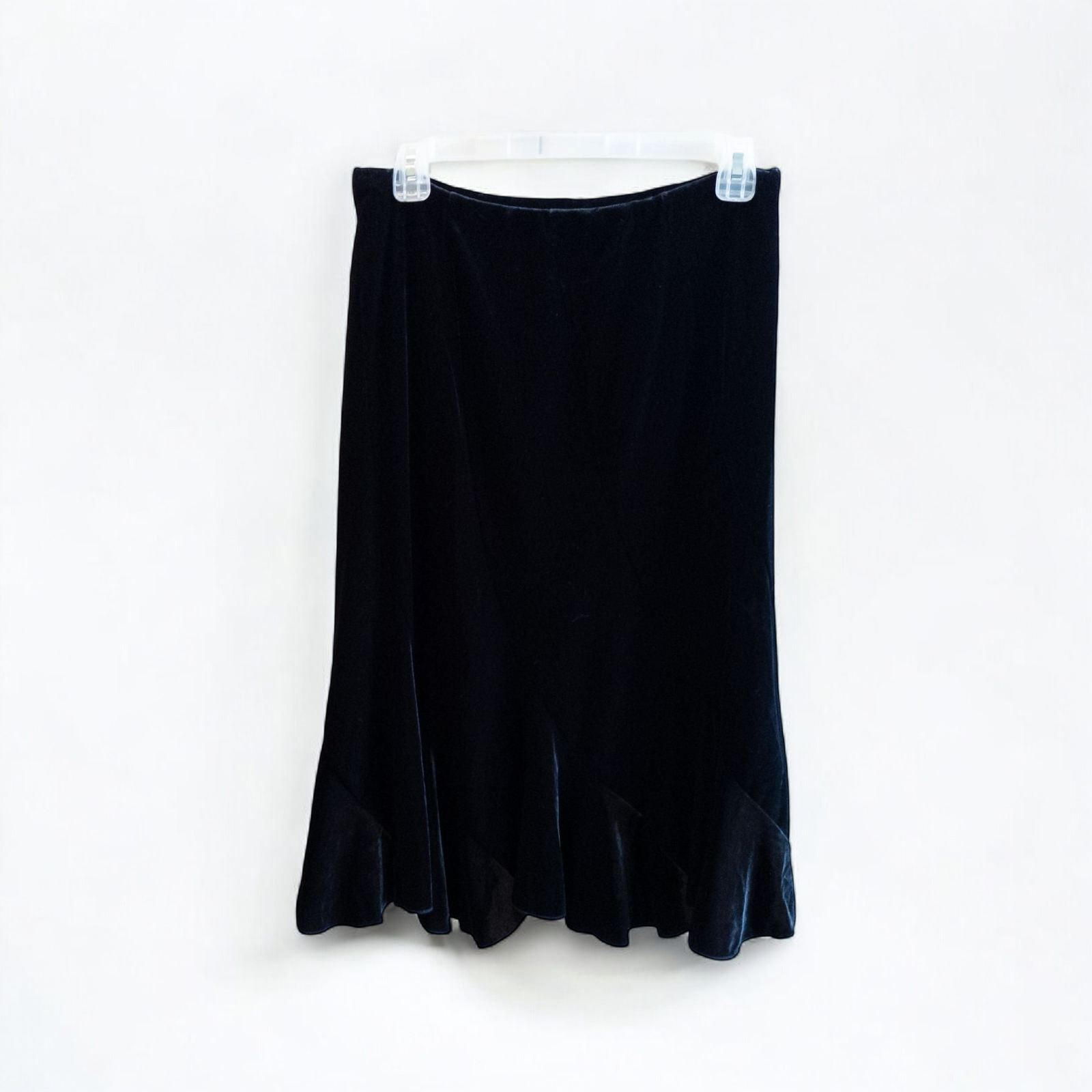 Alex black velvet jacket and skirt set hanging on hanger, showing classic fitted jacket with padded shoulders and flared skirt. image 6