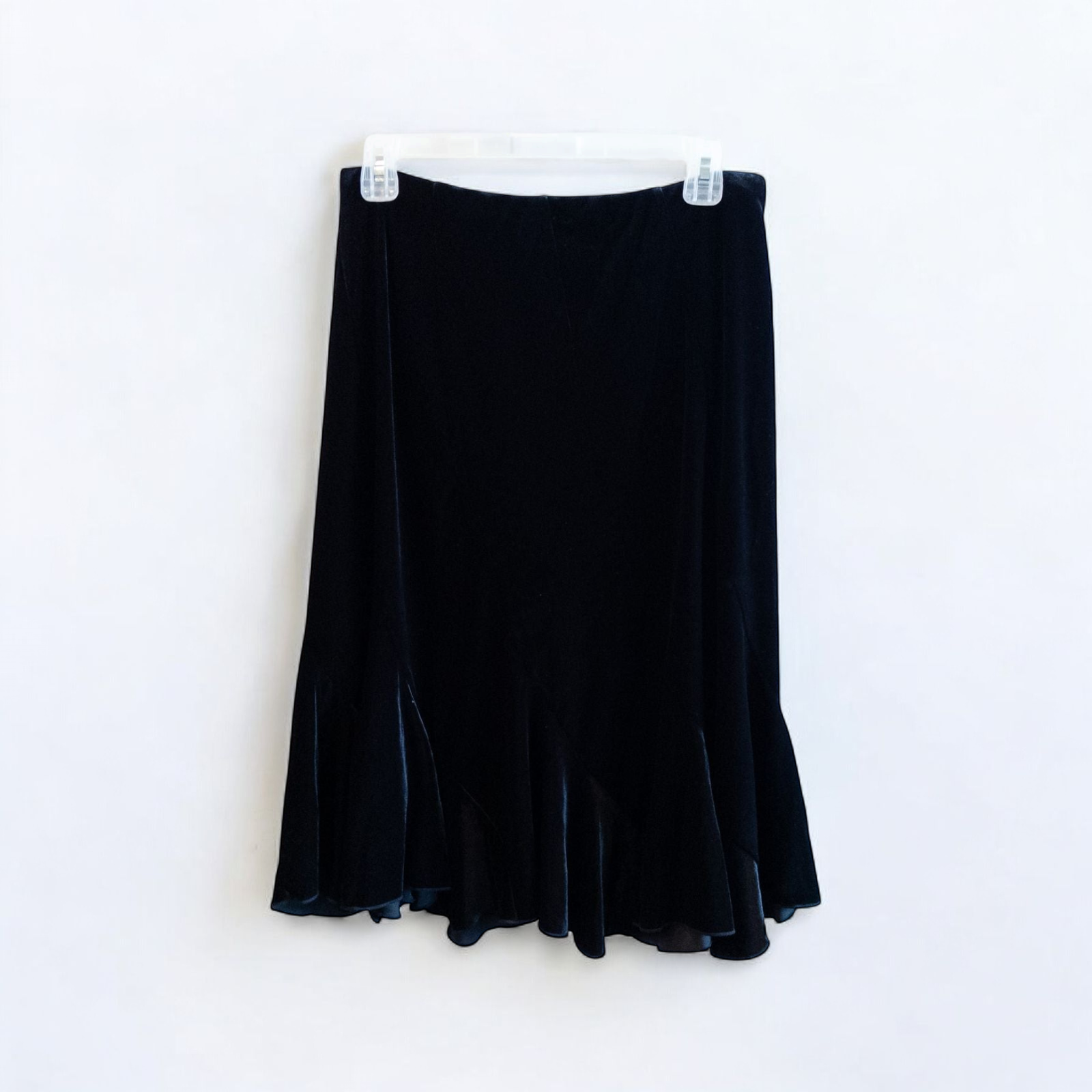 Alex black velvet jacket and skirt set hanging on hanger, showing classic fitted jacket with padded shoulders and flared skirt. image 8
