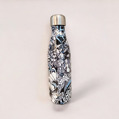 Starbucks Swizzle bottle with black white and blue artistic floral abstract print on countertop image 4