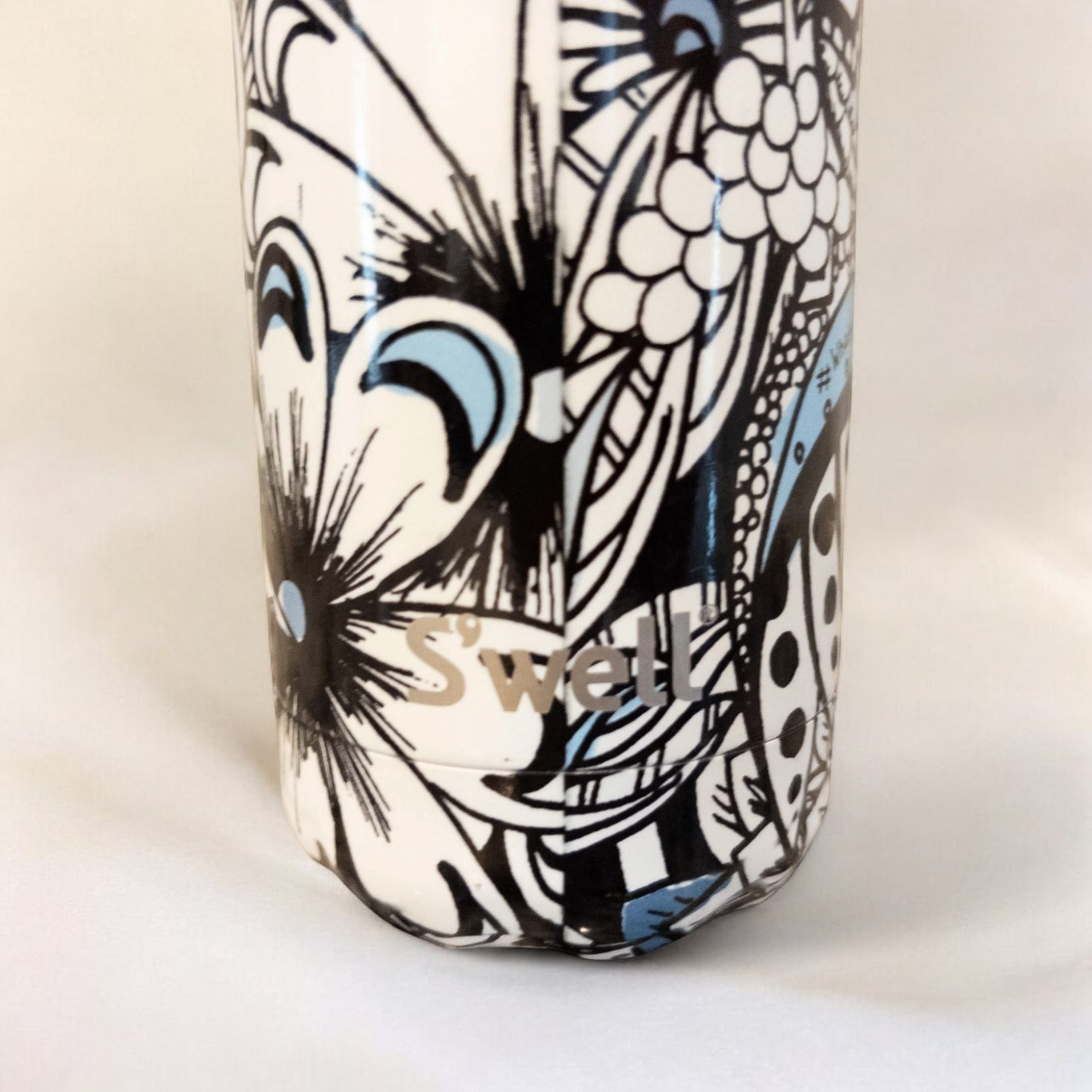 Starbucks Swizzle bottle with black white and blue artistic floral abstract print on countertop image 5
