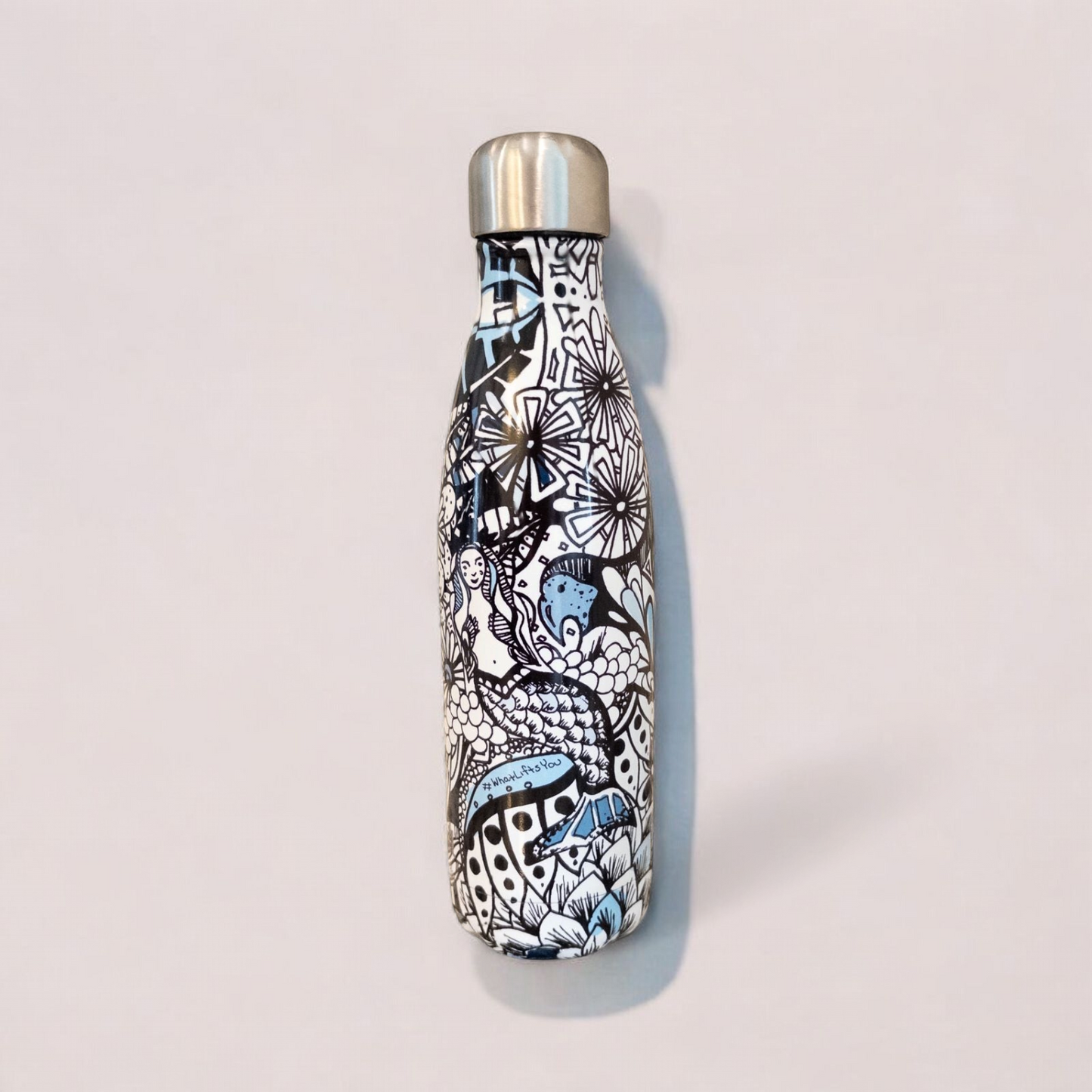 Starbucks Swizzle bottle with black white and blue artistic floral abstract print on countertop image 6
