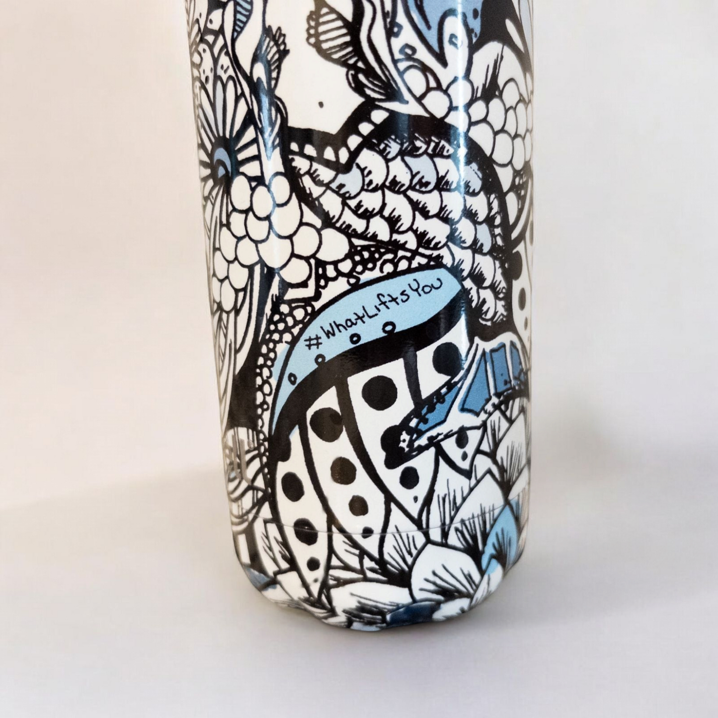 Starbucks Swizzle bottle with black white and blue artistic floral abstract print on countertop image 8