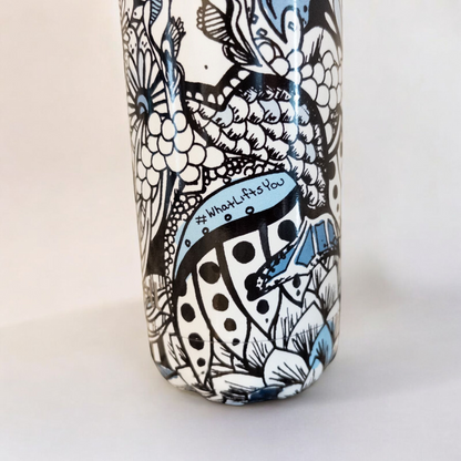 Starbucks Swizzle bottle with black white and blue artistic floral abstract print on countertop image 8