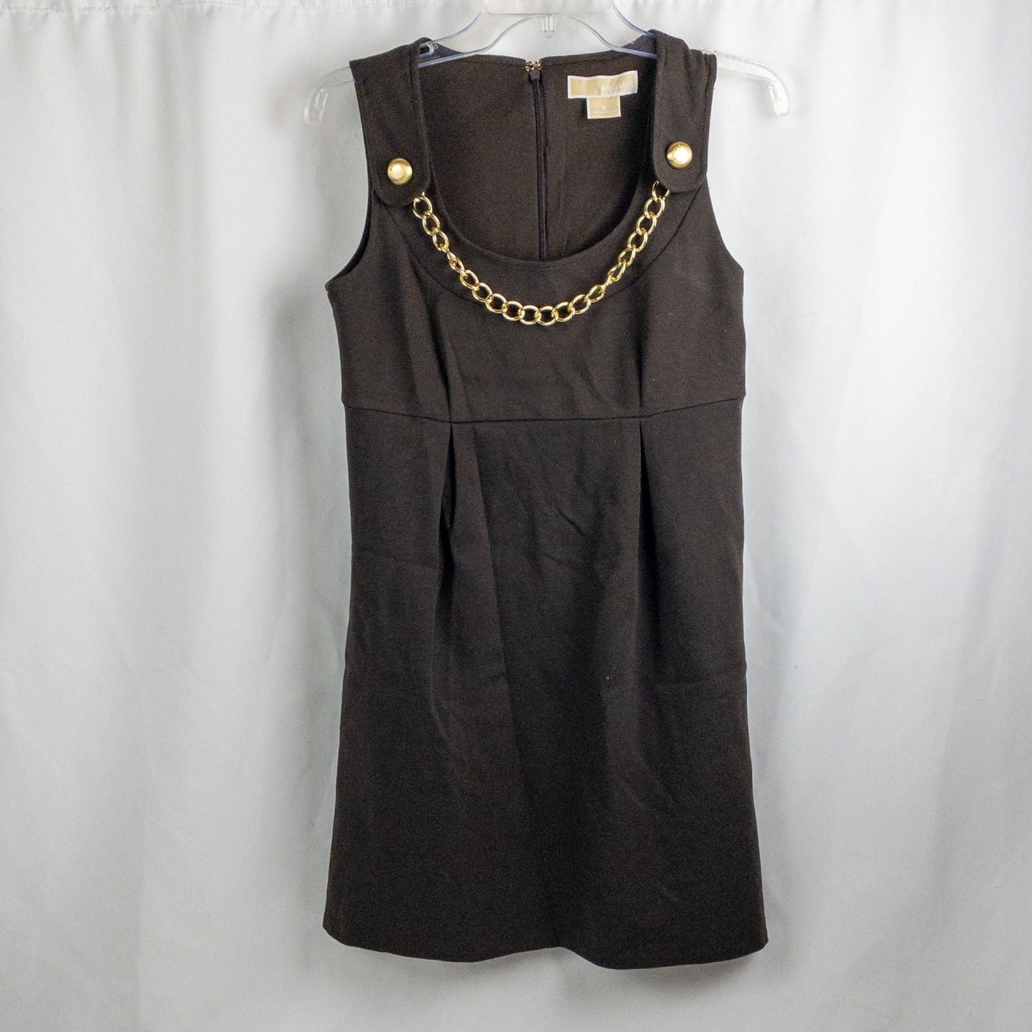 MICHAEL Michael Kors brown sleeveless dress with gold chain detail and back zipper closure on hanger
