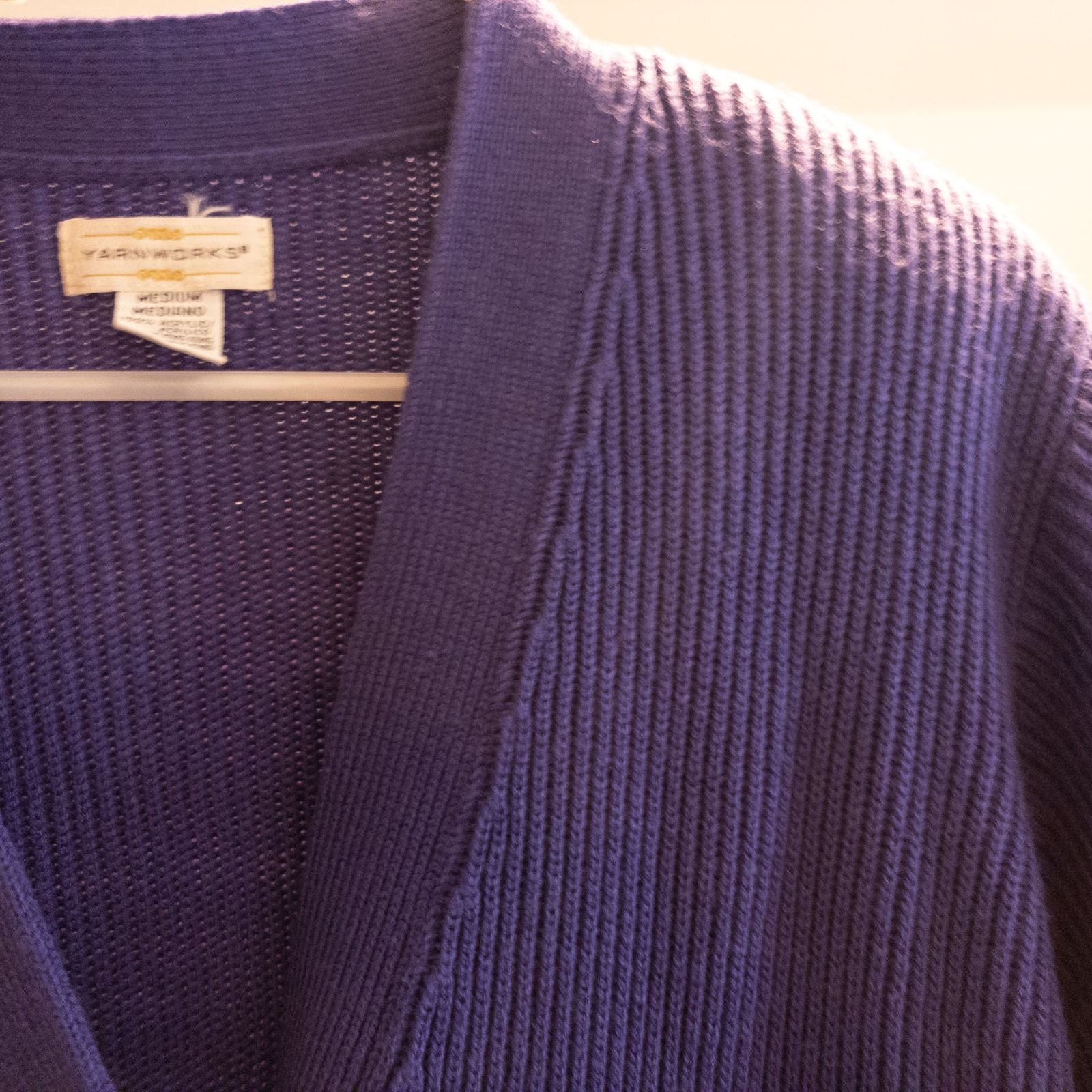 Vintage Yarnworks purple chunky knit cardigan with button front and two pockets hanging on hanger image 3