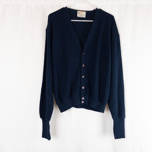 Vintage 1990s London Fog navy blue grandpa cardigan sweater with button front closure and ribbed cuffs on hanger