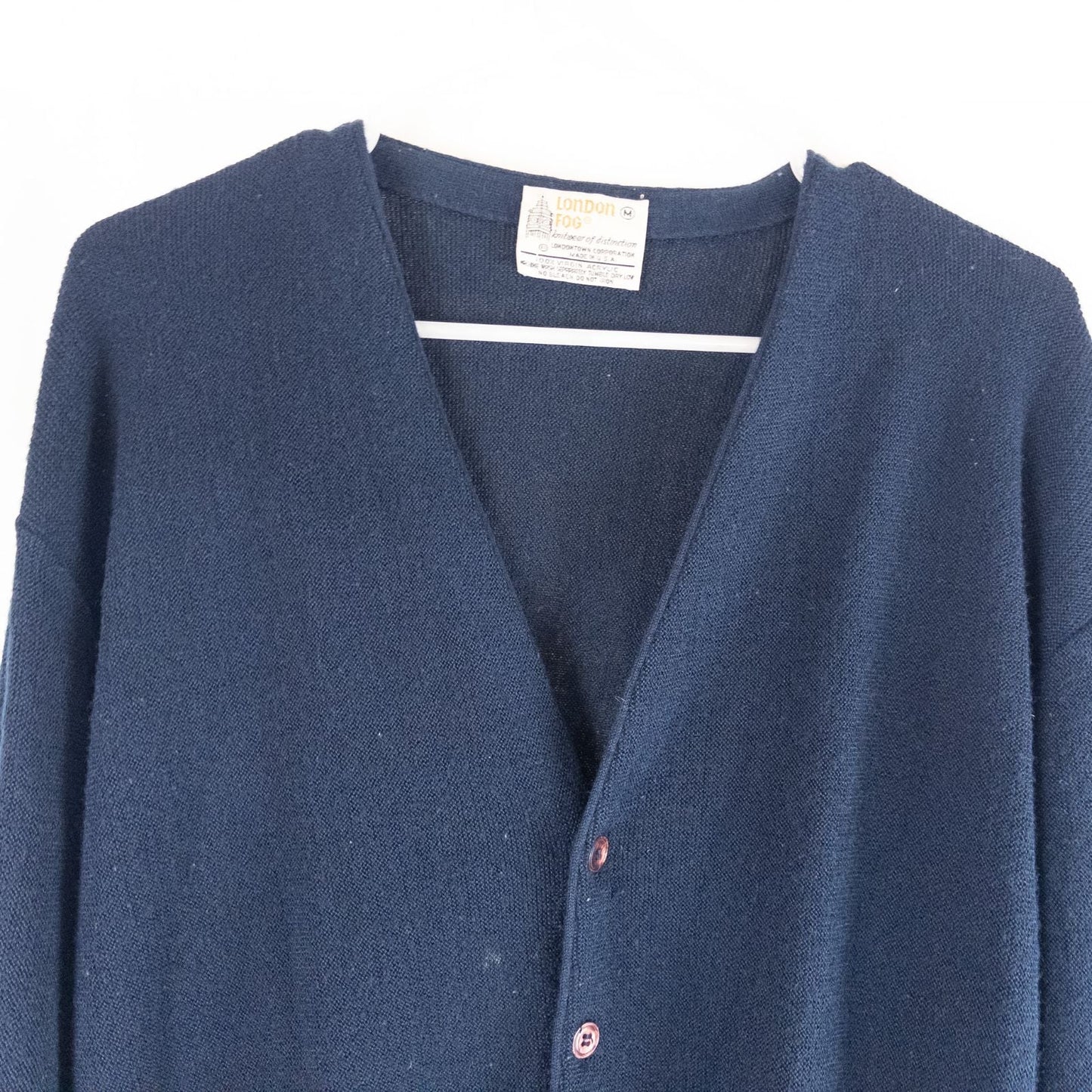 Vintage 1990s London Fog navy blue grandpa cardigan sweater with button front closure and ribbed cuffs on hanger image 2