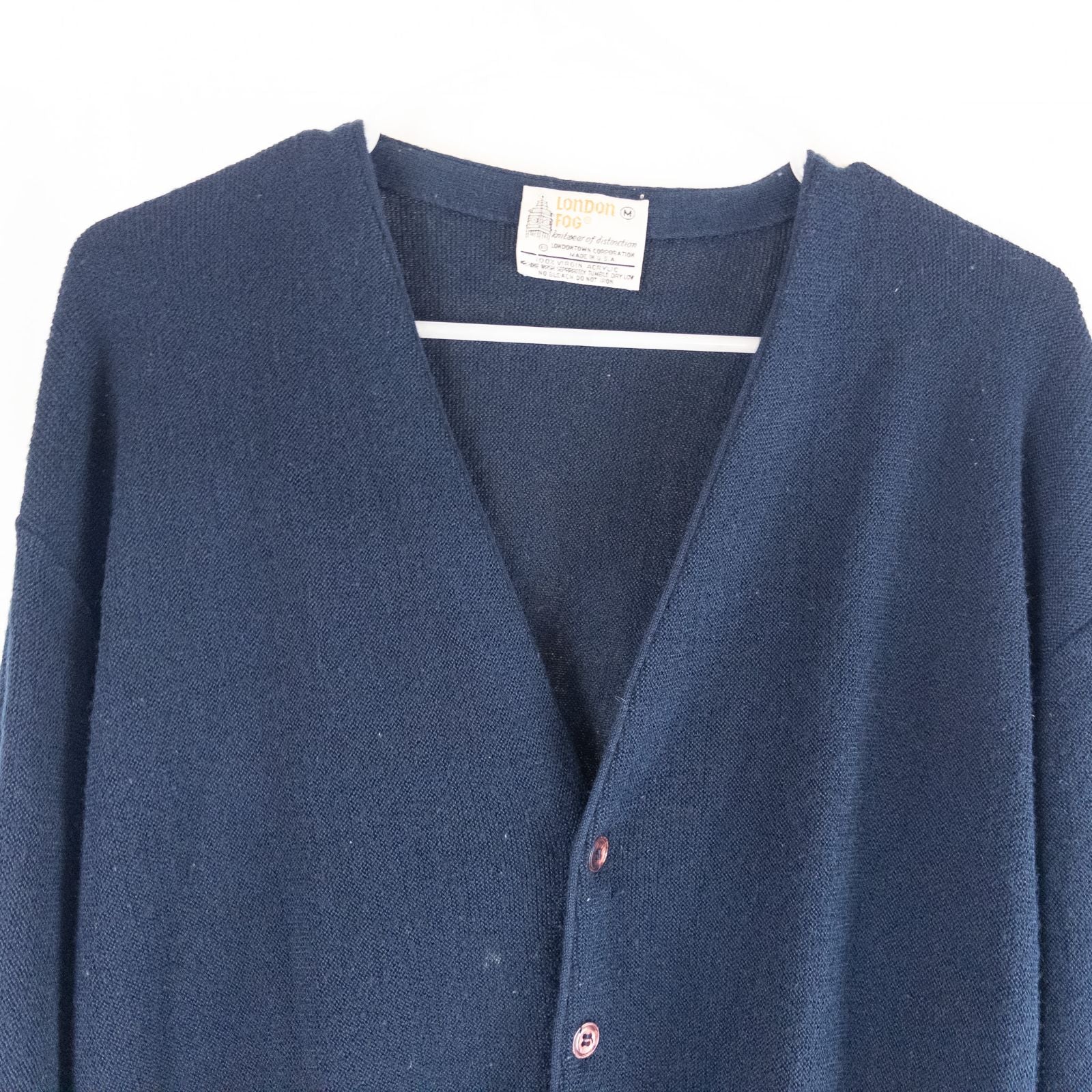 Vintage 1990s London Fog navy blue grandpa cardigan sweater with button front closure and ribbed cuffs on hanger image 2