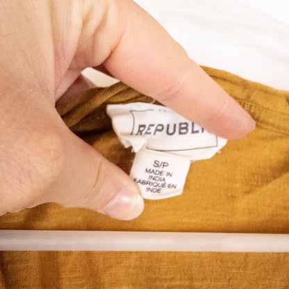 Republic brown scoop neck t-shirt with chest pocket hanging on a white hanger image 8