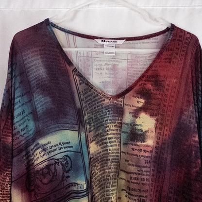 Nygard multicolor horoscope boho top with v-neck and short sleeves hanging on plastic hanger image 2