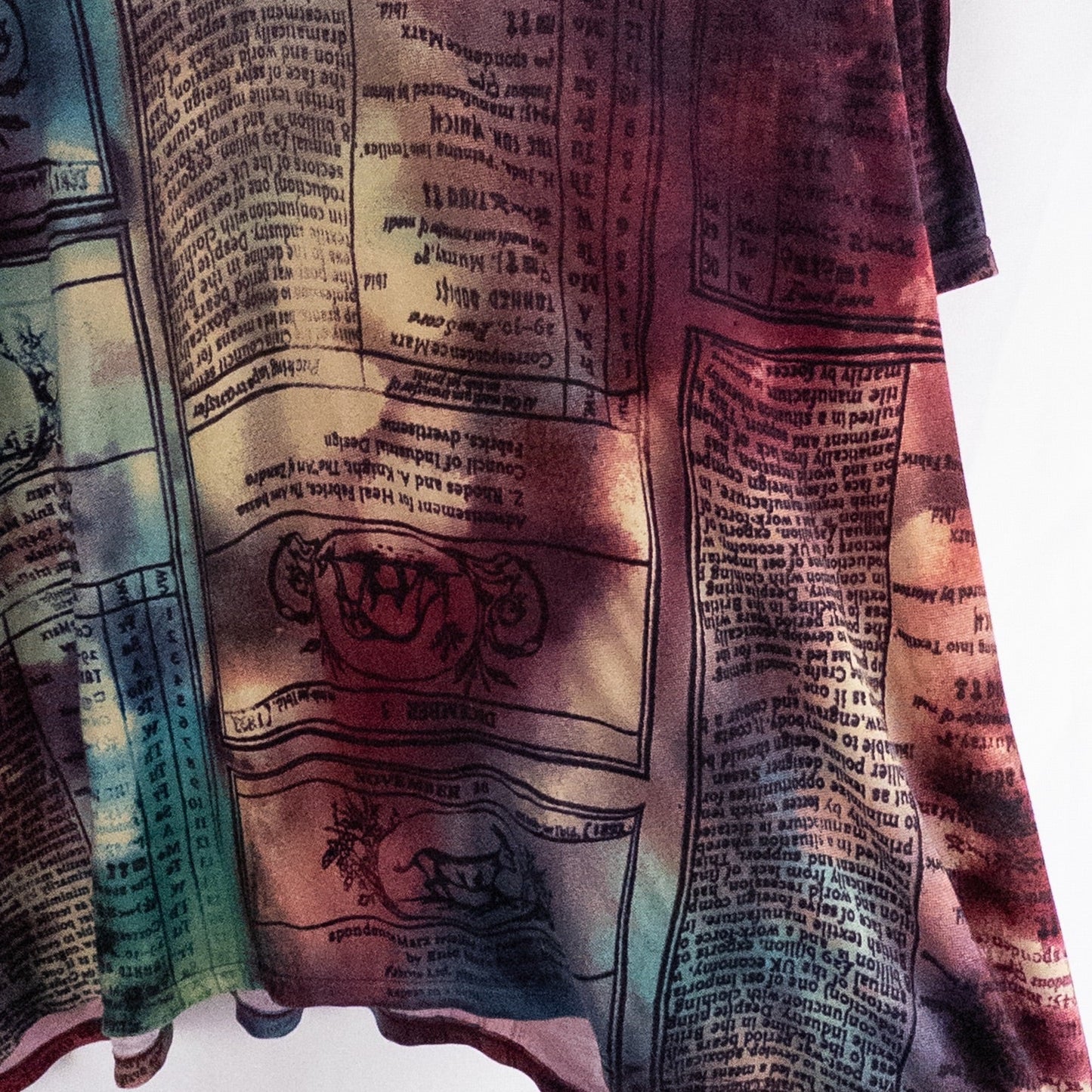 Nygard multicolor horoscope boho top with v-neck and short sleeves hanging on plastic hanger image 5