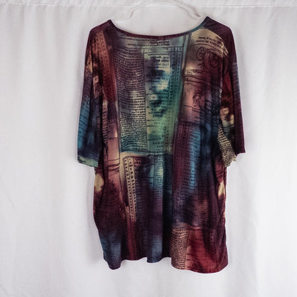 Nygard multicolor horoscope boho top with v-neck and short sleeves hanging on plastic hanger image 6