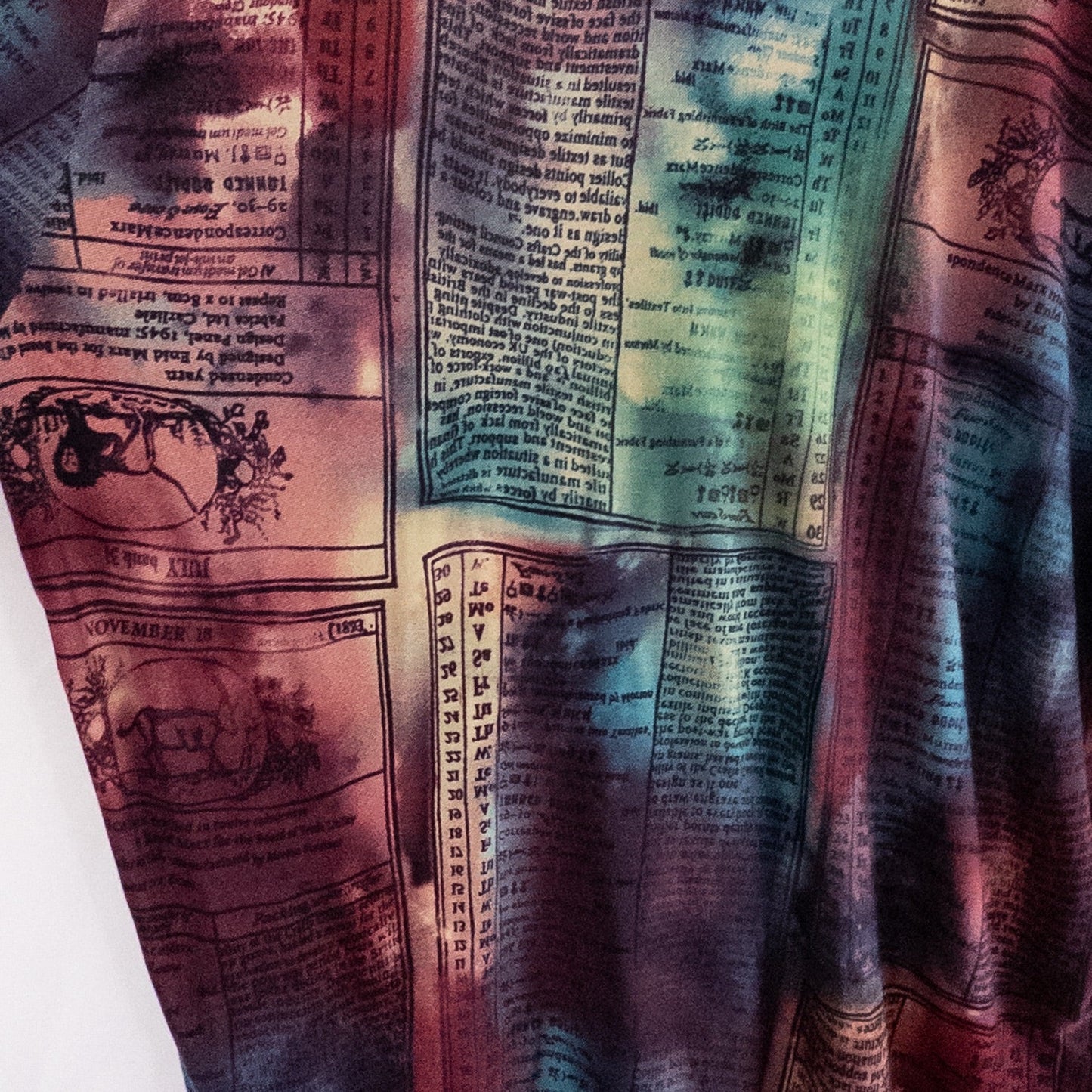 Nygard multicolor horoscope boho top with v-neck and short sleeves hanging on plastic hanger image 8