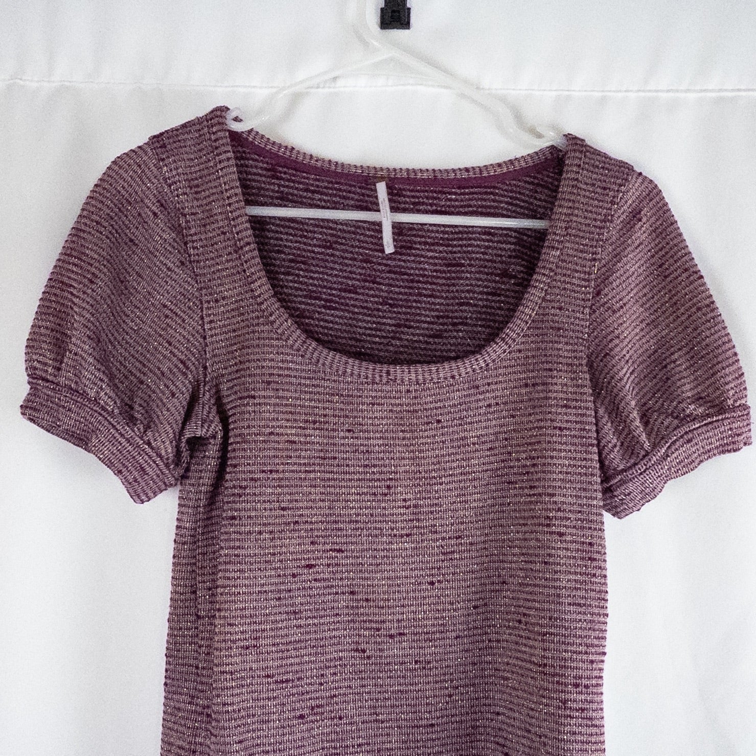 Free People knit purple and gold short puff sleeve sweater top on hanger against white background image 2