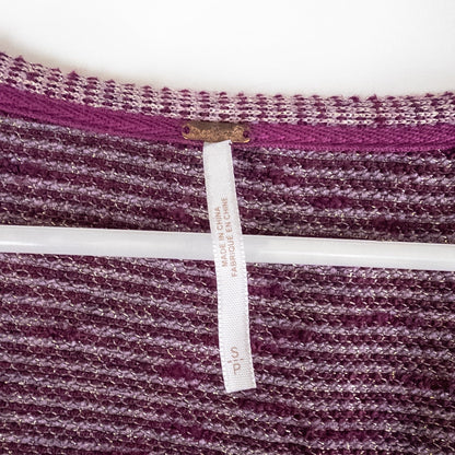 Free People knit purple and gold short puff sleeve sweater top on hanger against white background image 7