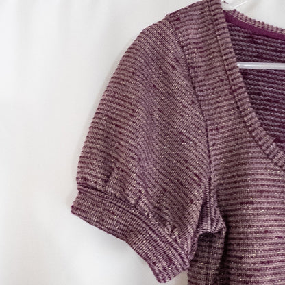 Free People knit purple and gold short puff sleeve sweater top on hanger against white background image 3