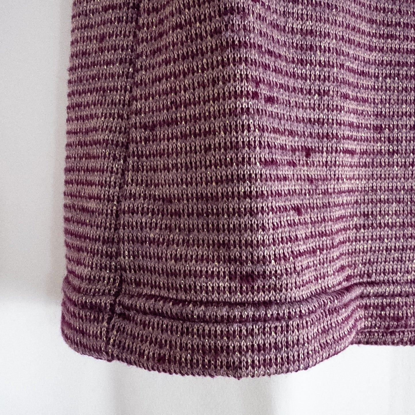 Free People knit purple and gold short puff sleeve sweater top on hanger against white background image 4