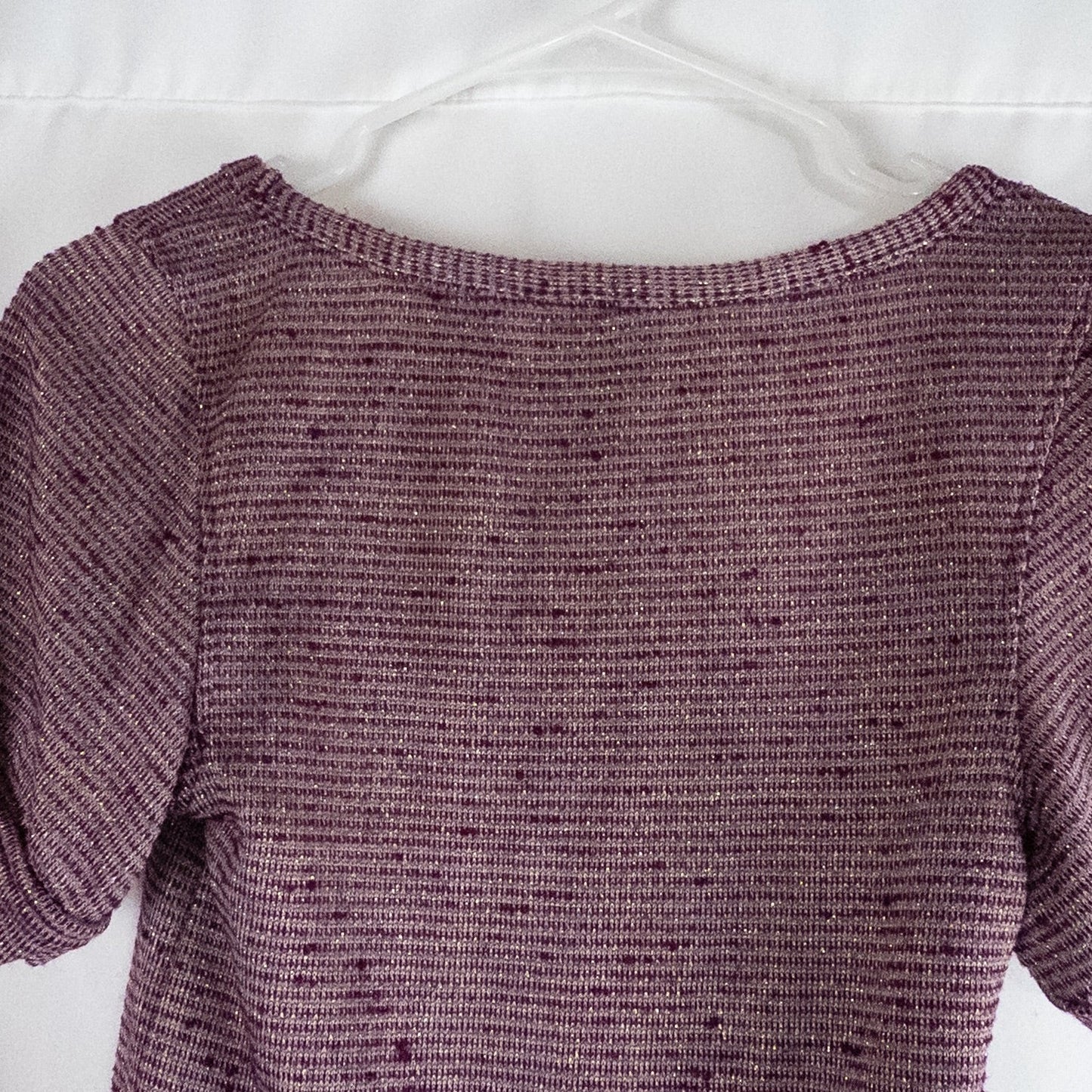 Free People knit purple and gold short puff sleeve sweater top on hanger against white background image 6