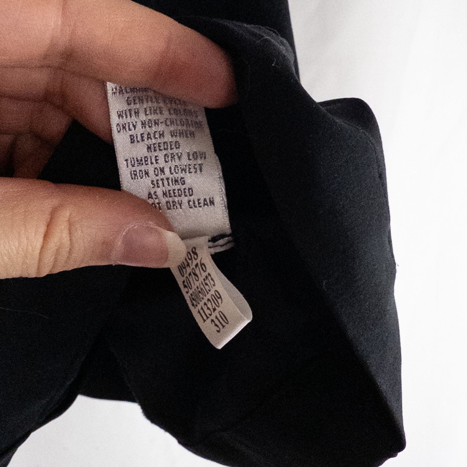 Chicos Zenergy black utility vest womens size 2 displayed on hanger showing front, back, collar, and smudge detail image 10