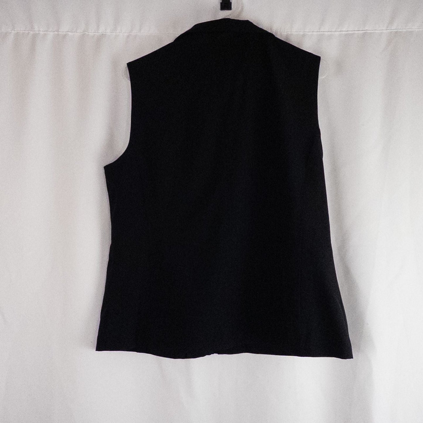 Chicos Zenergy black utility vest womens size 2 displayed on hanger showing front, back, collar, and smudge detail image 5