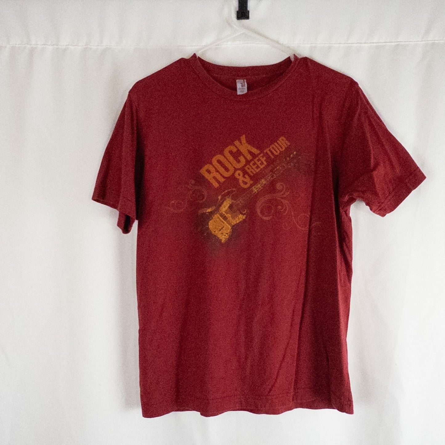 Red Anvil Rock & Reef Christian Rock Concert Tour graphic t-shirt with guitar print, medium size tag visible.