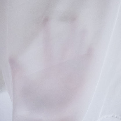 Anne Kriste vintage white sheer blouse with pearl beading on front and long sleeves with button cuffs hanging on hanger image 8